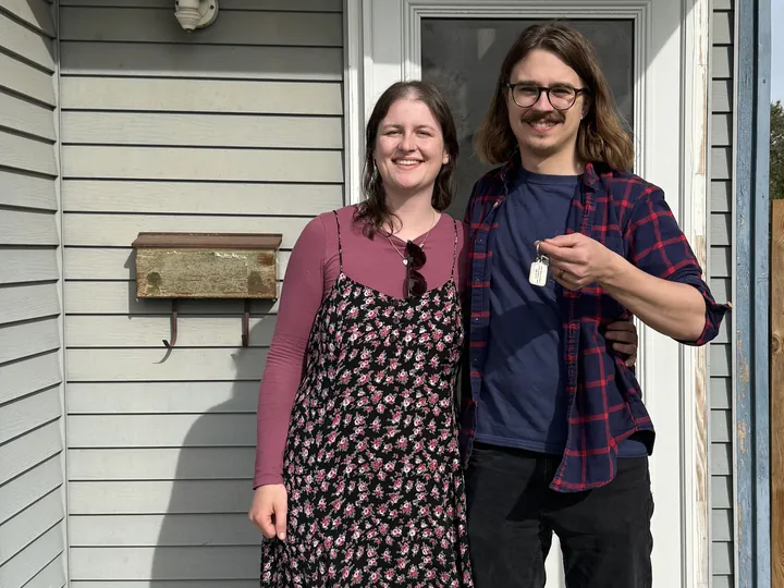 David W. holding the keys at the front door