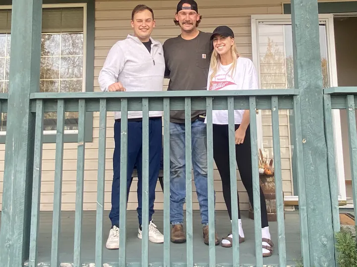 Nicole B. and Ty B. with Cameron on the porch