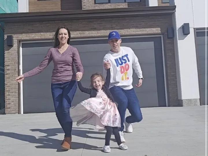 Richard H. and family in front of their home